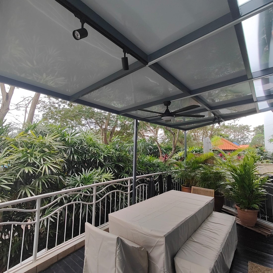 Glass pergola roof over a patio